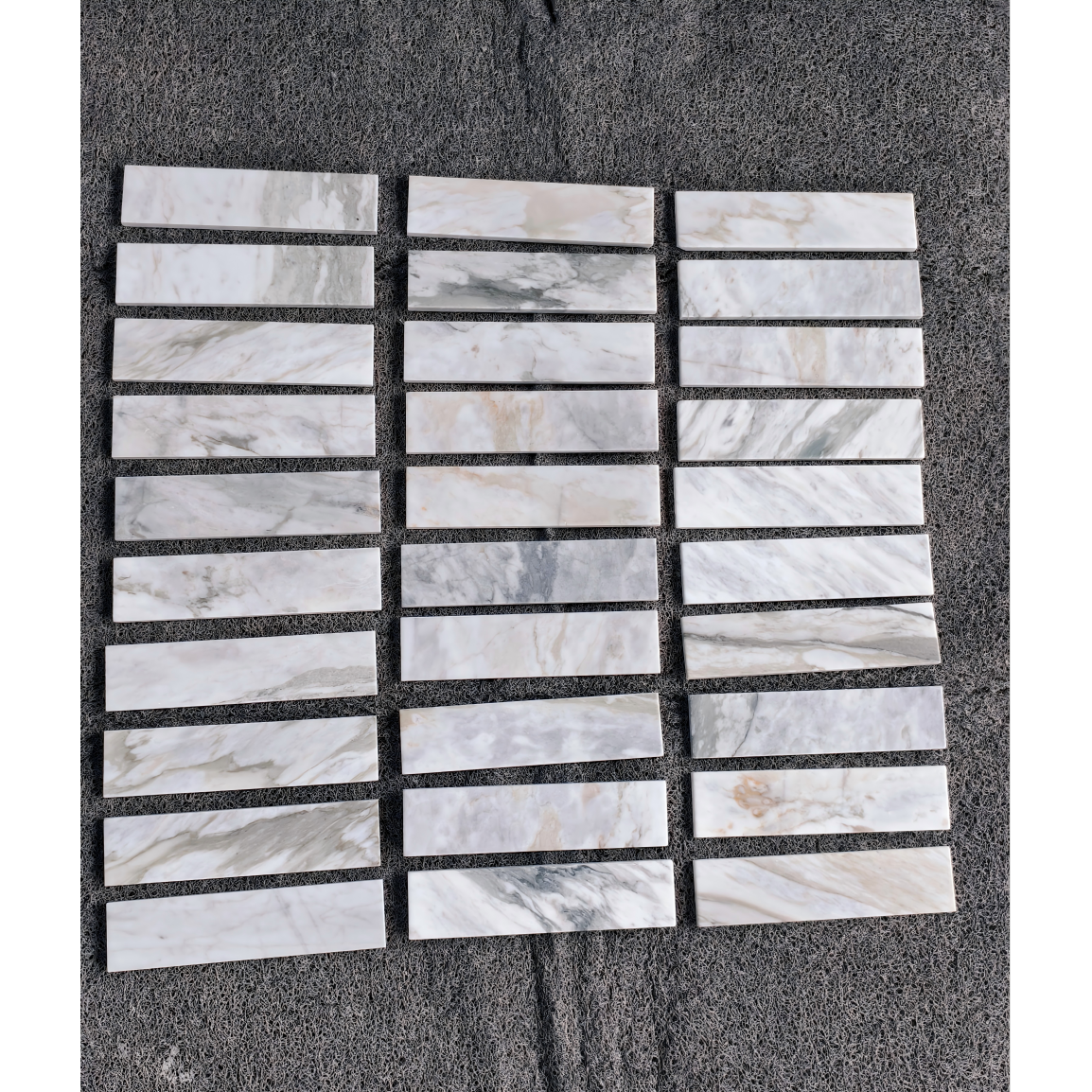 2.25" x 9" CALACATTA MANHATTAN BRUSHED & PILLOWED EDGE