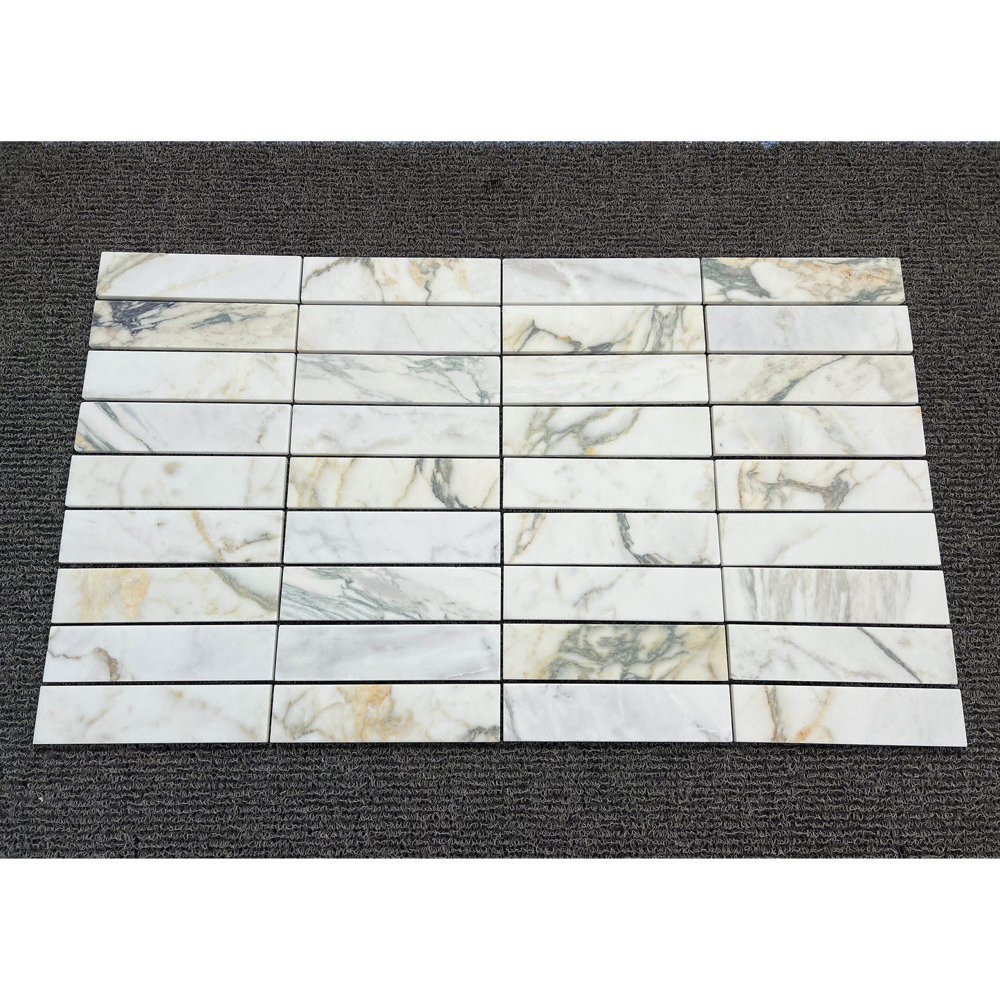 2.25" x 9" CALACATTA MONET BRUSHED & PILLOWED EDGE