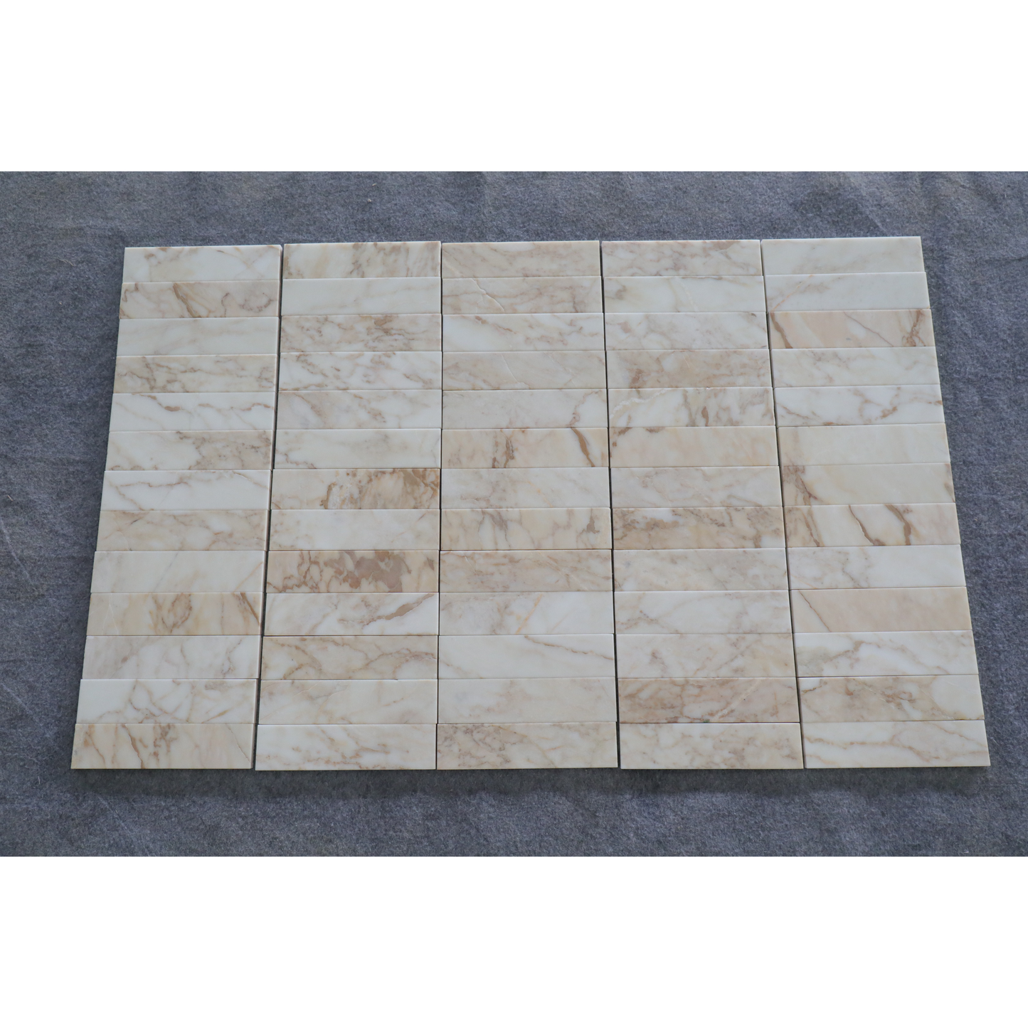 2.25" x 9" CALACATTA VAGLI BRUSHED & PILLOWED EDGE